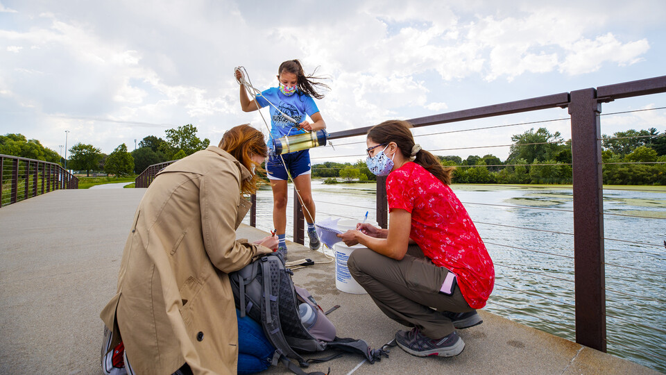 Photo Credit: Students and a faculty mentor working on a dock for research
