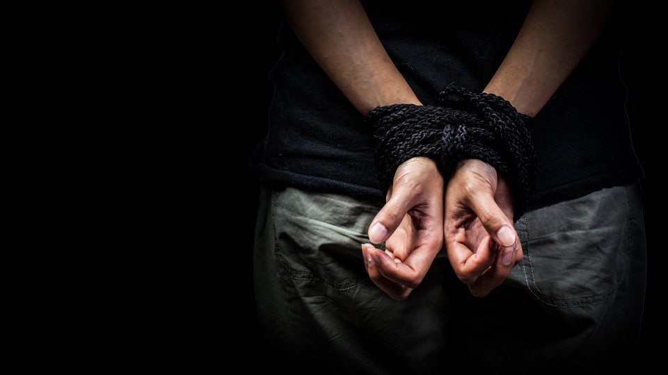 Photo Credit: Image of hands tied behind the back