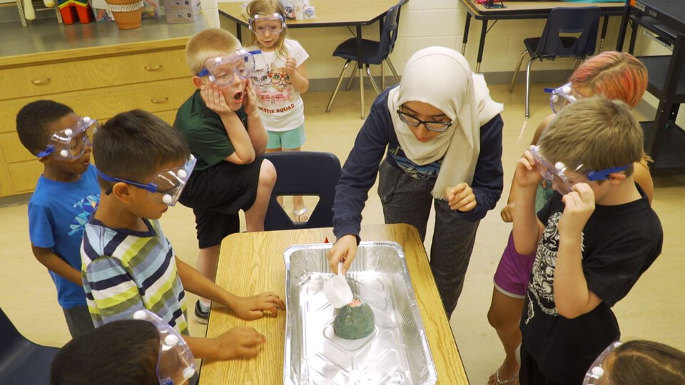 Photo Credit: Nora Husein conducts a science experiment during her after-school club in 2019