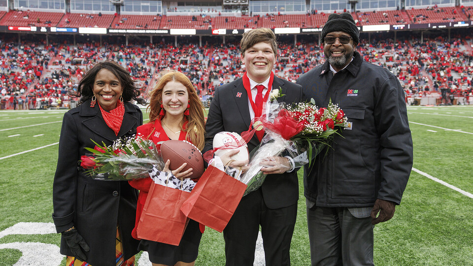 Photo Credit: Newly crowned homecoming royalty Hannah-Kate Kinney (second from left) and Preston Kotik (third from left) are joined by Chancellor Rodney Bennett (right) and his wife, Temple (left).