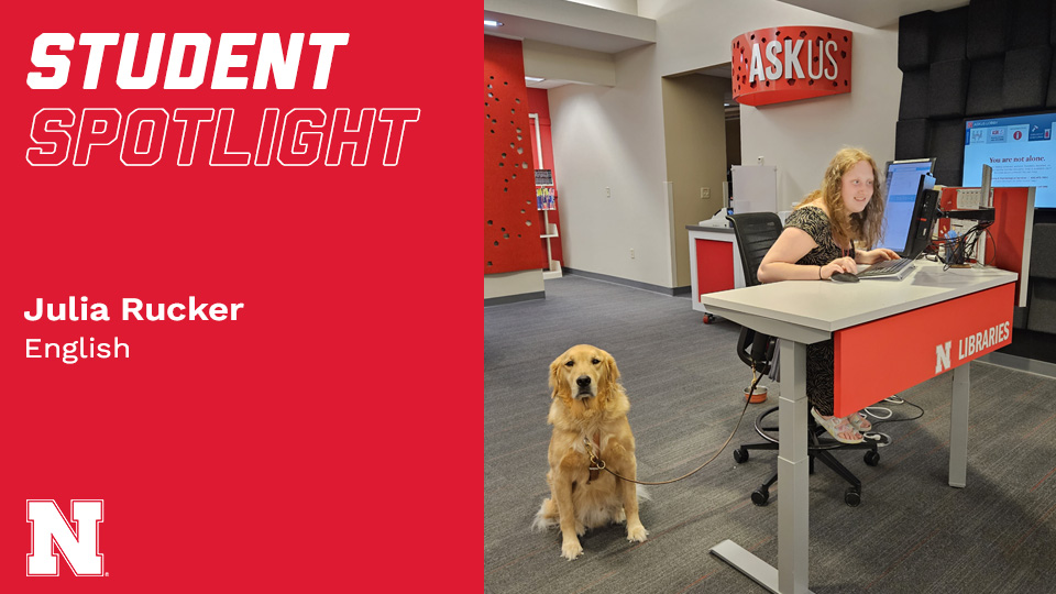 Photo Credit: Julia Rucker and her service dog, Carson, work the ASKus Desk in Love Library South.
