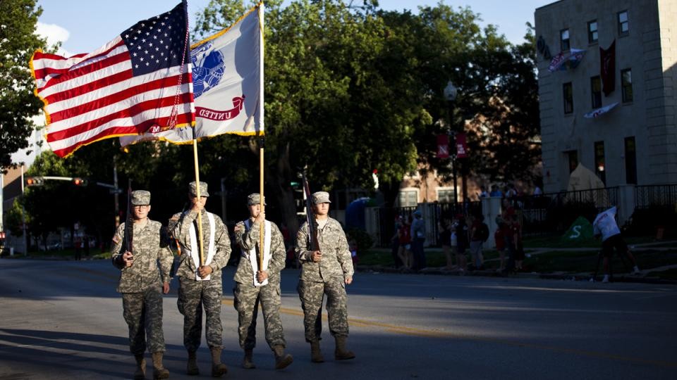 Photo Credit: ROTC cadets holding an American flag