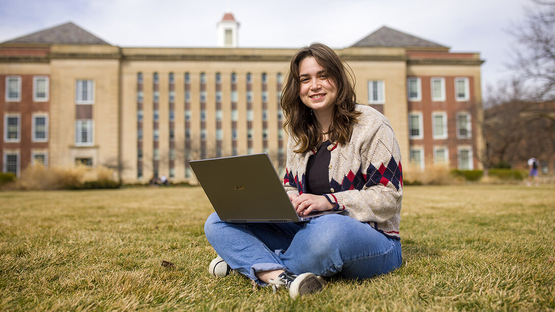 Student with laptop outside