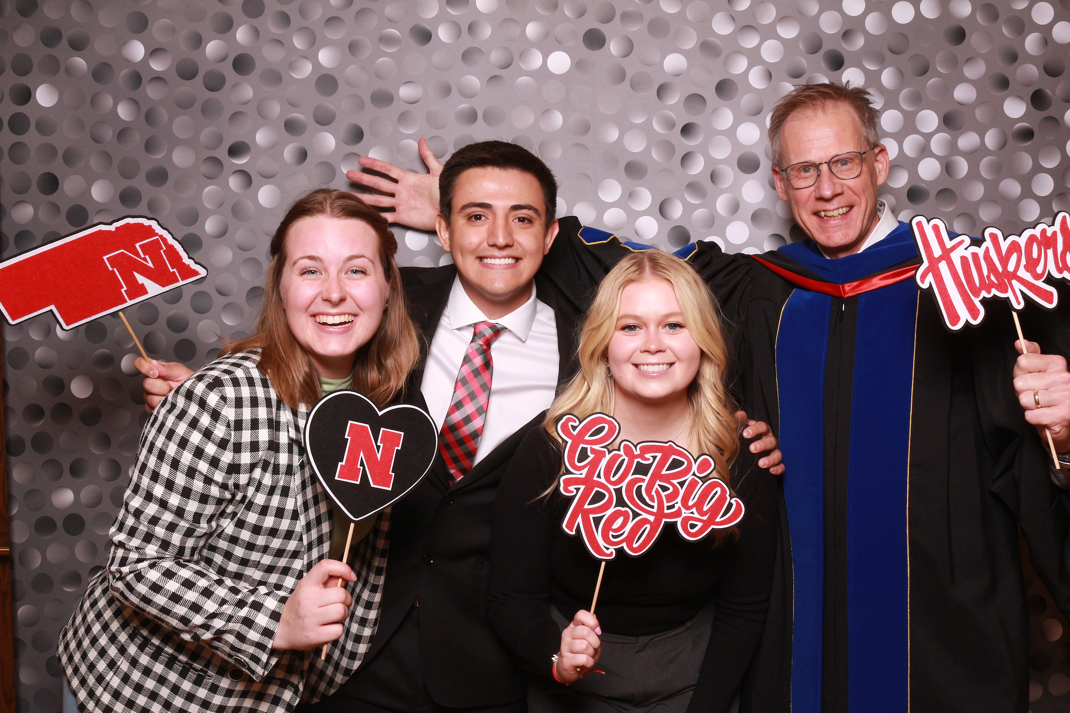 Dean Button with three graduating seniors