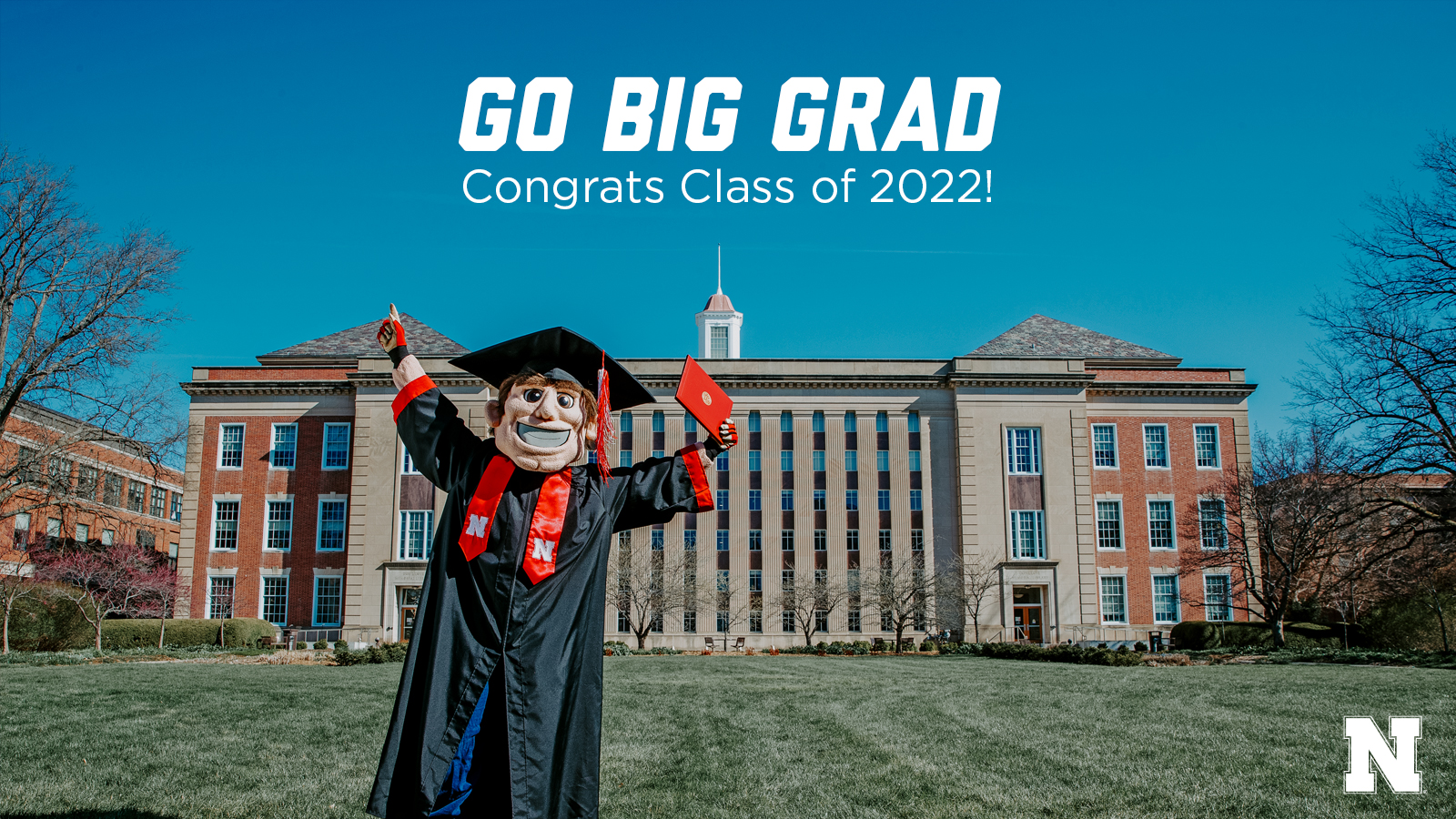 Herbie in regalia with Go Big Grad message