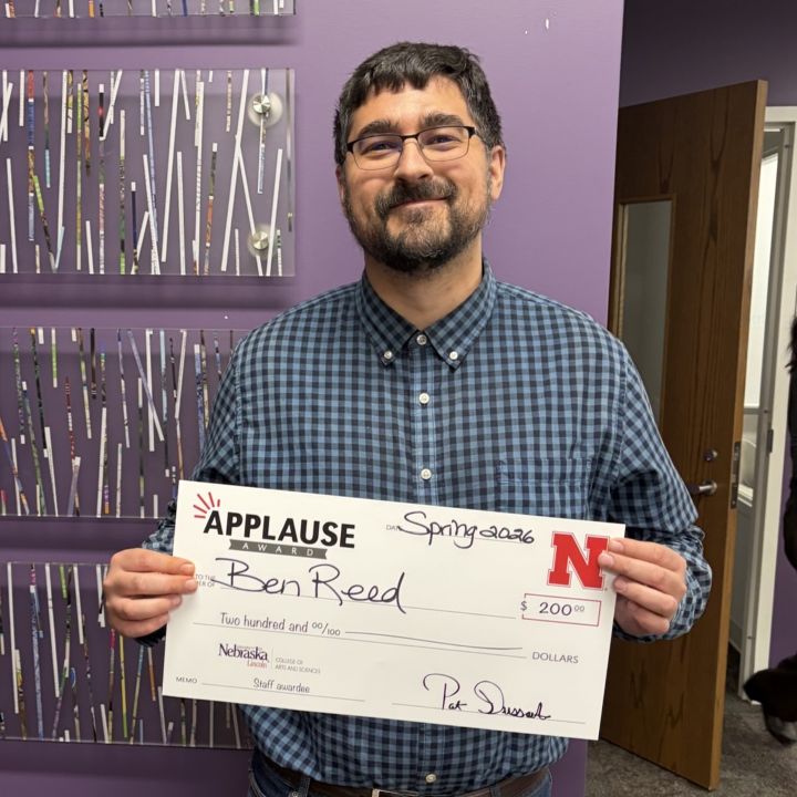 Ben Reed holding an Applause check
