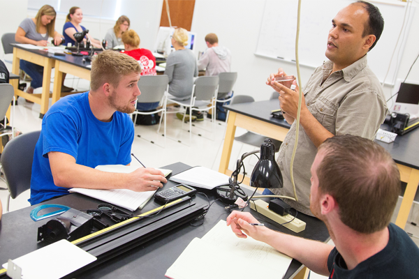 Students and instructor in the Physics Resource Center