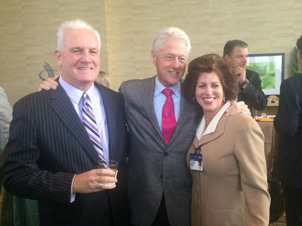 Hinman with Bill Clinton and others