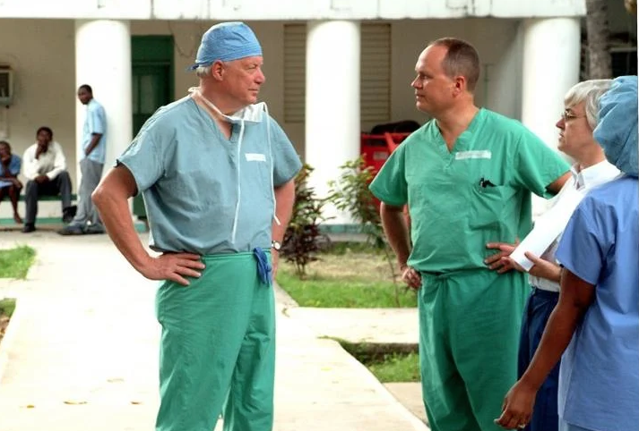 Dr. Stuart Embury and people in scrubs