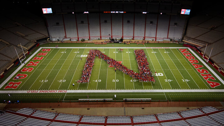 Members of the University of Nebraska–Lincoln's freshman class line up in the shape of an "N" during the New Student Tunnel Walk on Aug. 27. For the second year, enrollment at the university has surged to an all-time high.