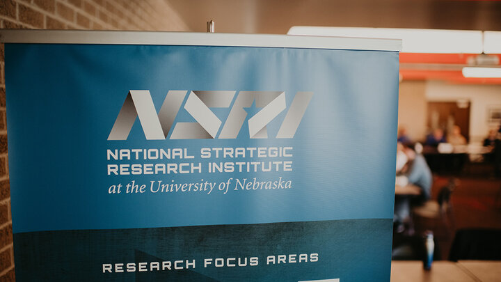 An NSRI banner hangs at an event sponsored by the research group.