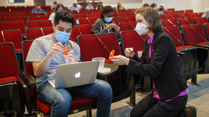 Rebecca Roston (right), associate professor of biochemistry, works with Alex Teano to help visualize how a molecule binds with an enzyme. The lesson was part of a biochemistry course that uses 3-D printed molecules to help students better visualize molecular structures and functions.