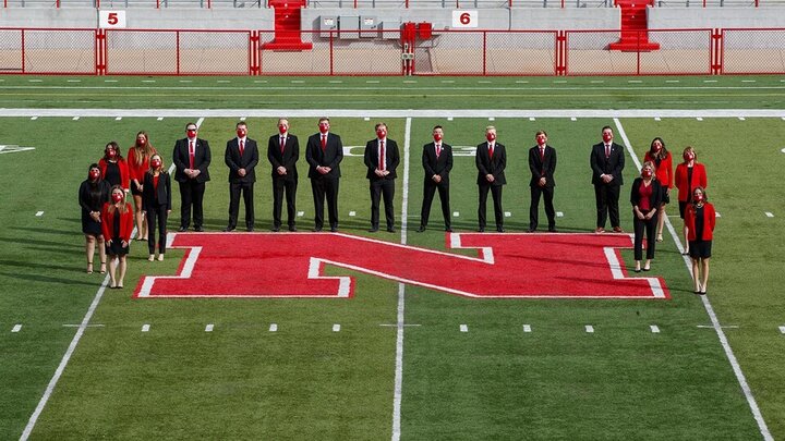 Students standing on the football field