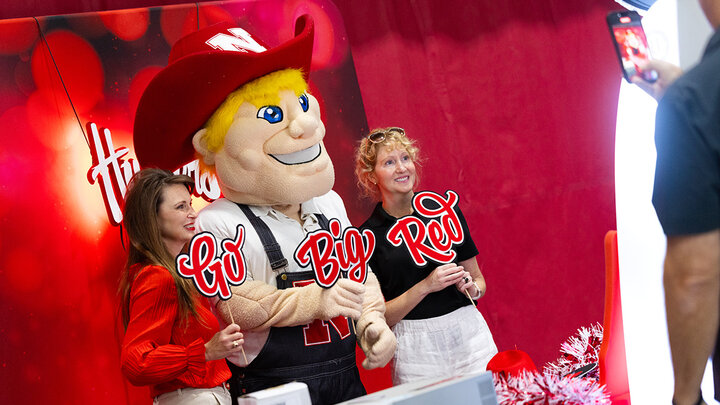 Carmen Kelle and Kristin Plath pose for a selfie with Herbie Husker during the Celebration of Service. Both are advisers in the College of Arts and Sciences; Kelle was recognized for 30 years at UNL and Plath was recognized for 15 years of service.