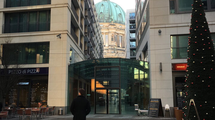 Nick Wensel takes a shortcut between buildings to get to the Berlin Cathedral