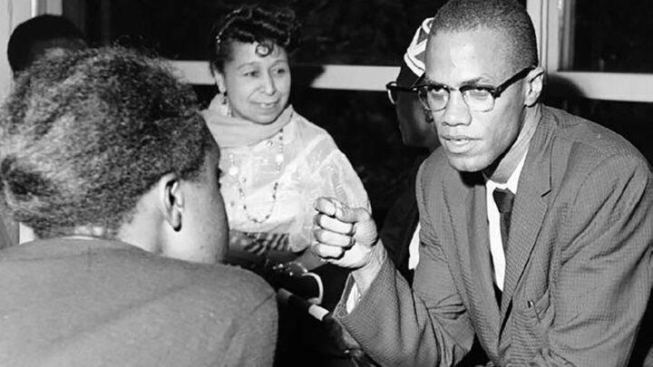 Malcolm X, likely at a welcoming event for the African-American Students Foundation in 1959 or 1960