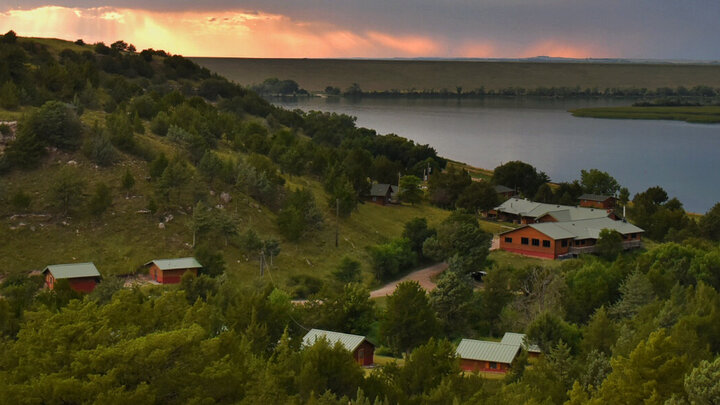 Several cabins sit on the shores of Lake Ogallala.