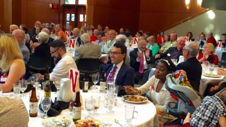 Speech and Debate reunion attendees at tables