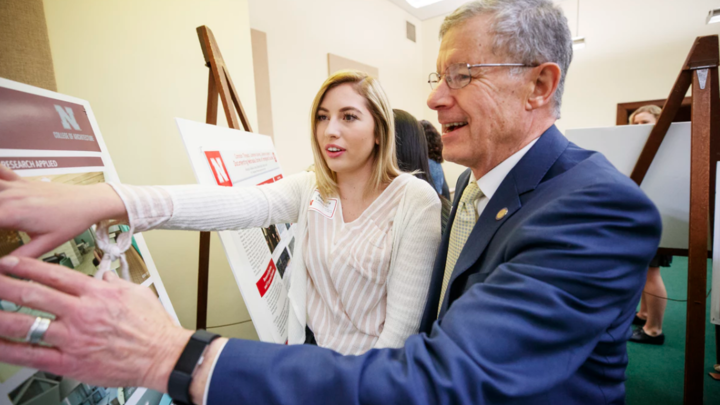 Sen. John S. McCollister and Amanda VanBuren discuss her research on the design of outpatient healthcare facilities.