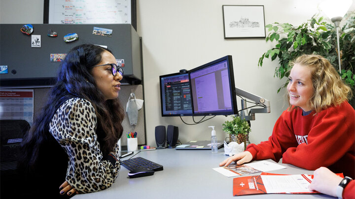 Advisor and student talking